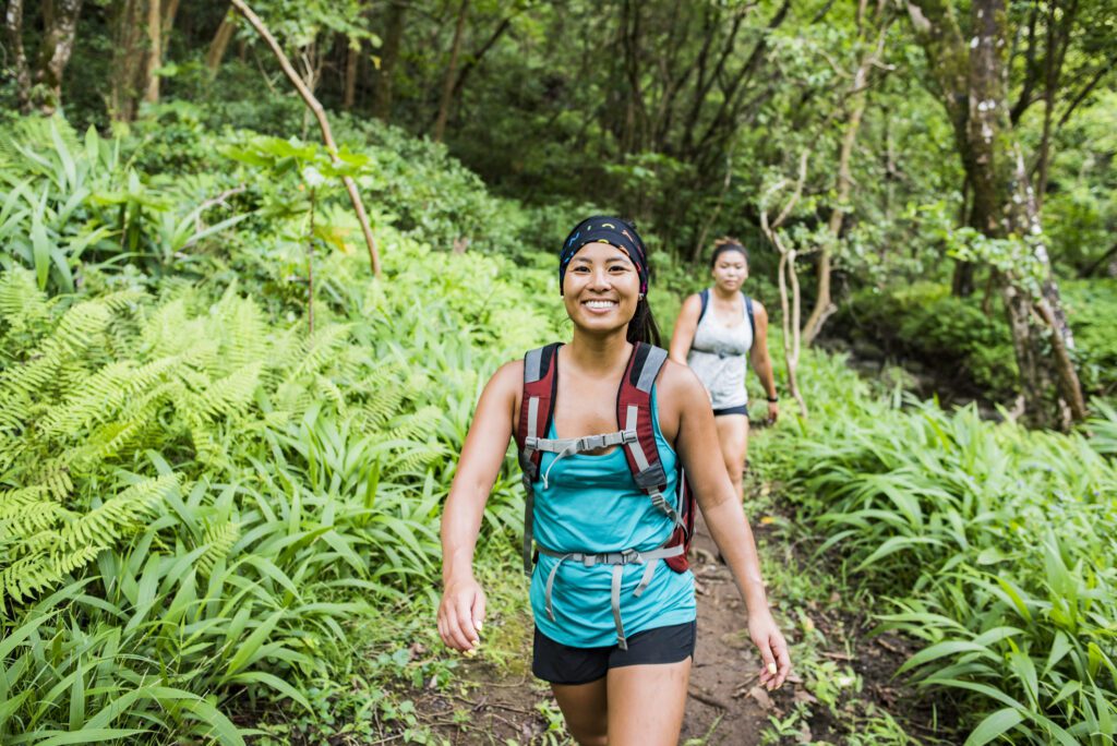 Two women hiking on Moanalua Valley Trail, Oahu, Hawaii