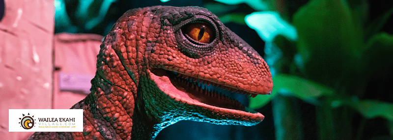 Close up of statue of red velociraptor