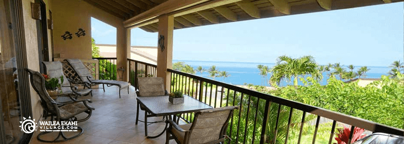 View of beach and greenery from balcony of vacation rental condo