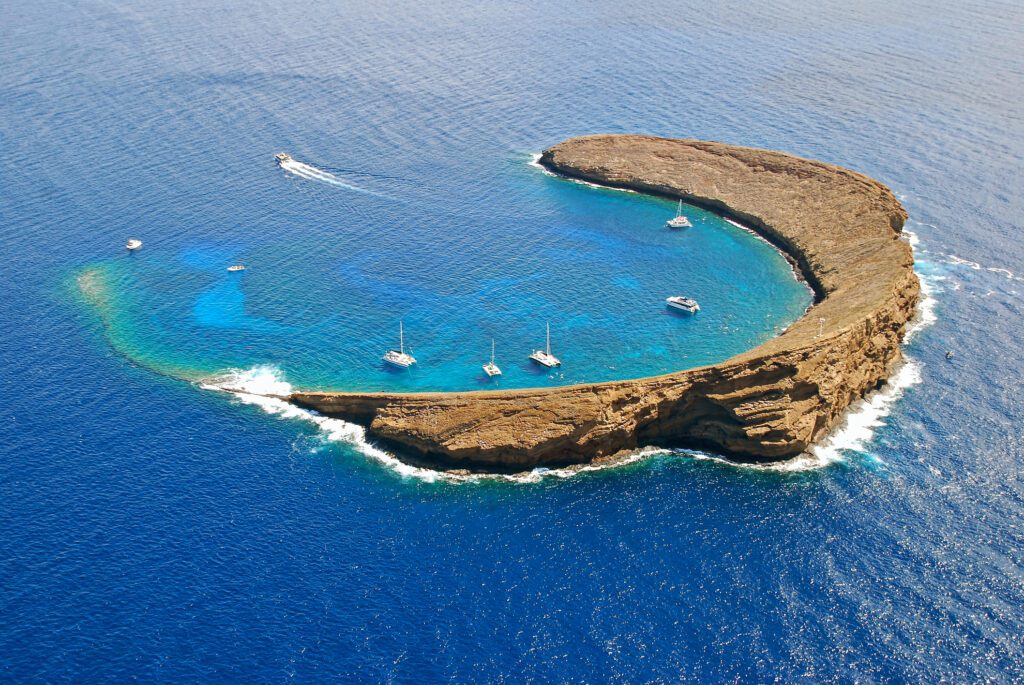 Aerial view inside Molokini Island with boats moored there, Maui, Hawaii