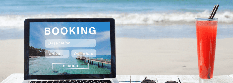 Laptop with "Booking" on the screen and resort website