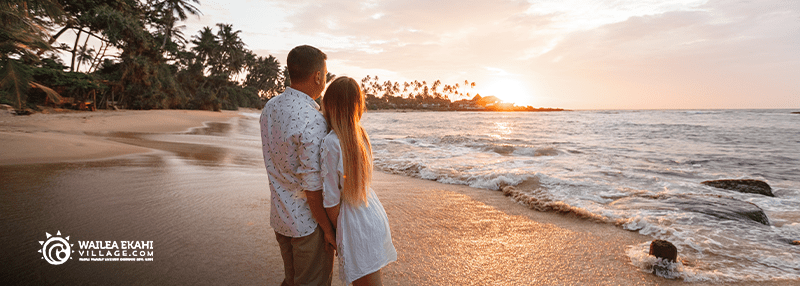 Couple hugging on the beach in Maui