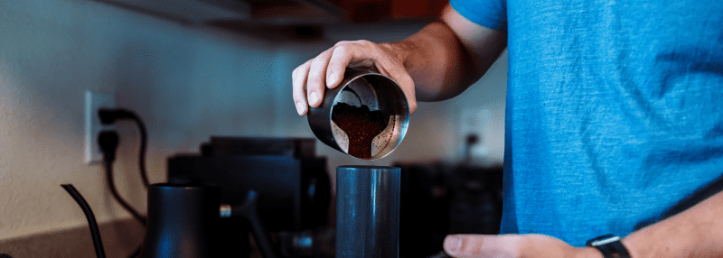 Man making coffee at his Hawaii accommodation
