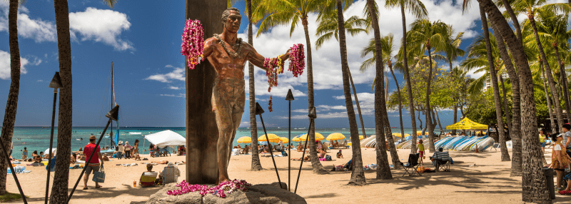 Statue of Duke Kahanamoku in front of Kuhio Beach Park in Waikiki.
